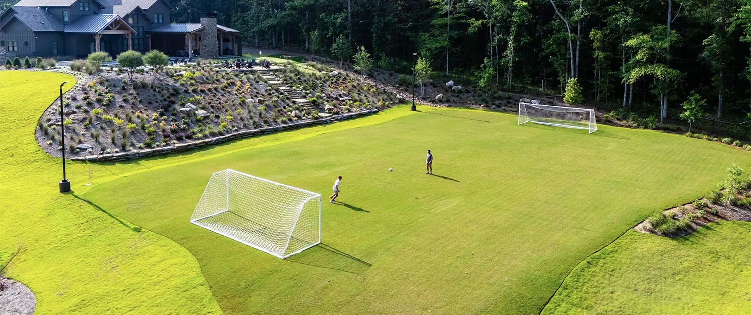 A gorgeous backyard landscaping project complete with soccer field and golfing, designed, built, and maintained by R&R Landscaping