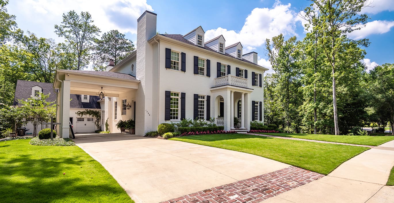 R&R Landscaping A resort-style backyard with beautiful plants, a swimming pool, fire pit, and putting green. This landscape was designed and built by R&R Landscaping.