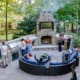 A beautiful outdoor kitchen and sitting area perfect for tailgating at home. This project was designed and built by R&R Landscaping