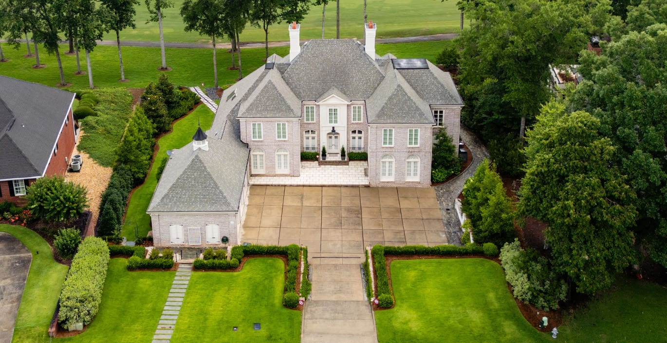 R&R Landscaping A beautiful outdoor living space designed and built by R&R Landscaping, complete with luscious plants and intentional stone paths to guide guests through the garden, all designed to be comforting and welcoming.
