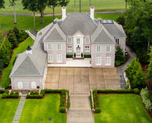 A beautiful outdoor living space designed and built by R&R Landscaping, complete with luscious plants and intentional stone paths to guide guests through the garden, all designed to be comforting and welcoming.