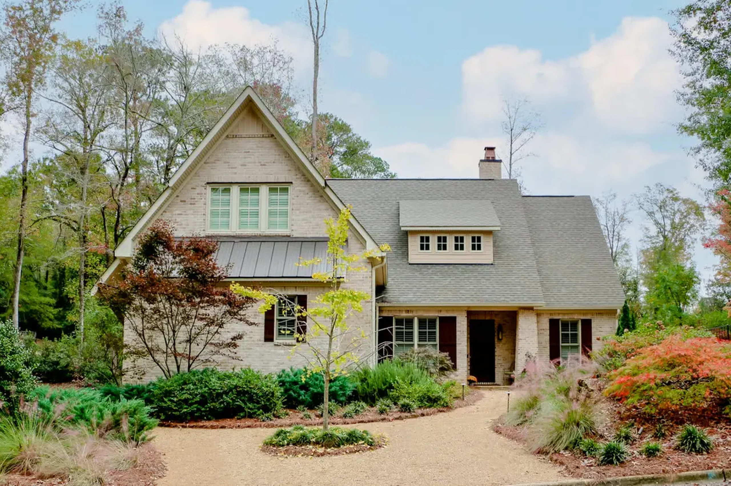 16LawnlessInTheSouth-2560x1703 Craftsman-style home framed by mature trees and layered foundation plantings