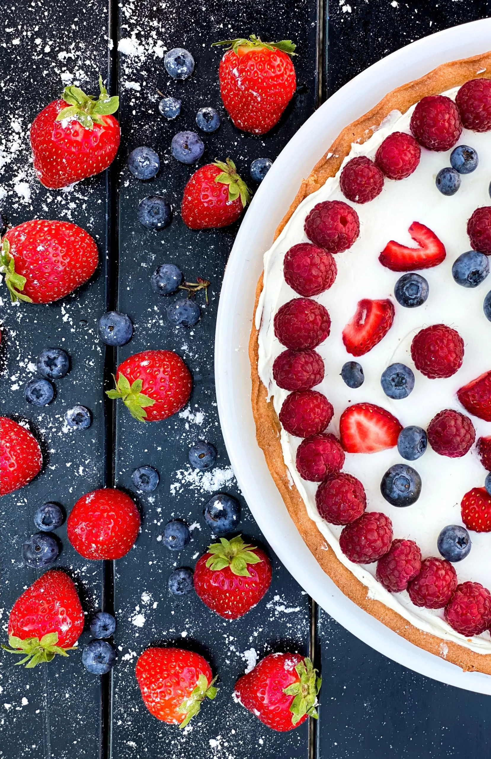 pexels-296478879-13279207 a picture of strawberries in a table and a strawberry cake thats white
